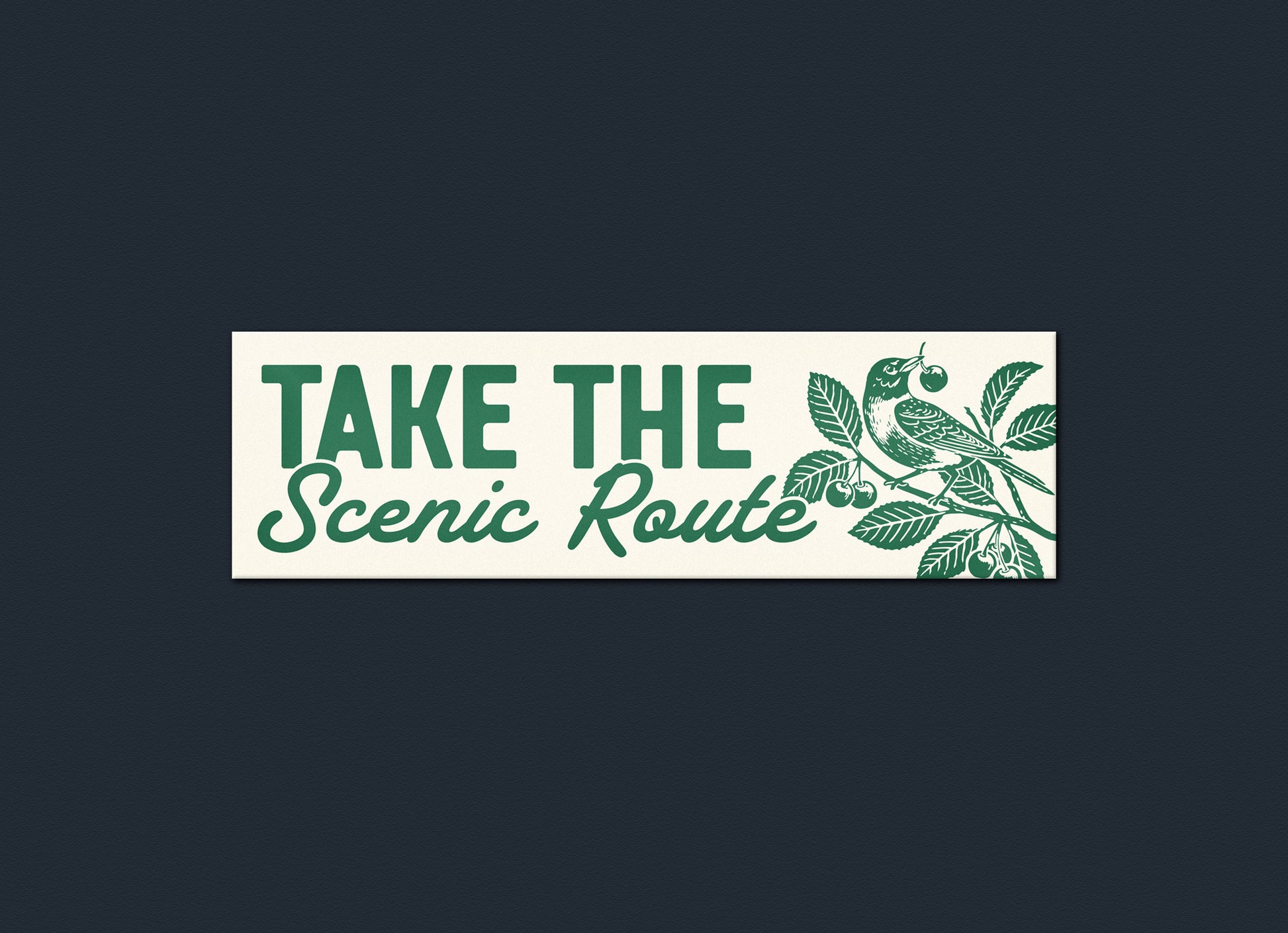 Decorative sign with 'Take the Scenic Route' text and nature-themed design on a dark background